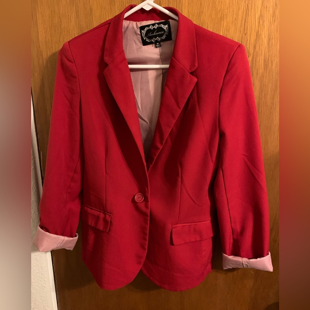 Red blazer with striped lining.